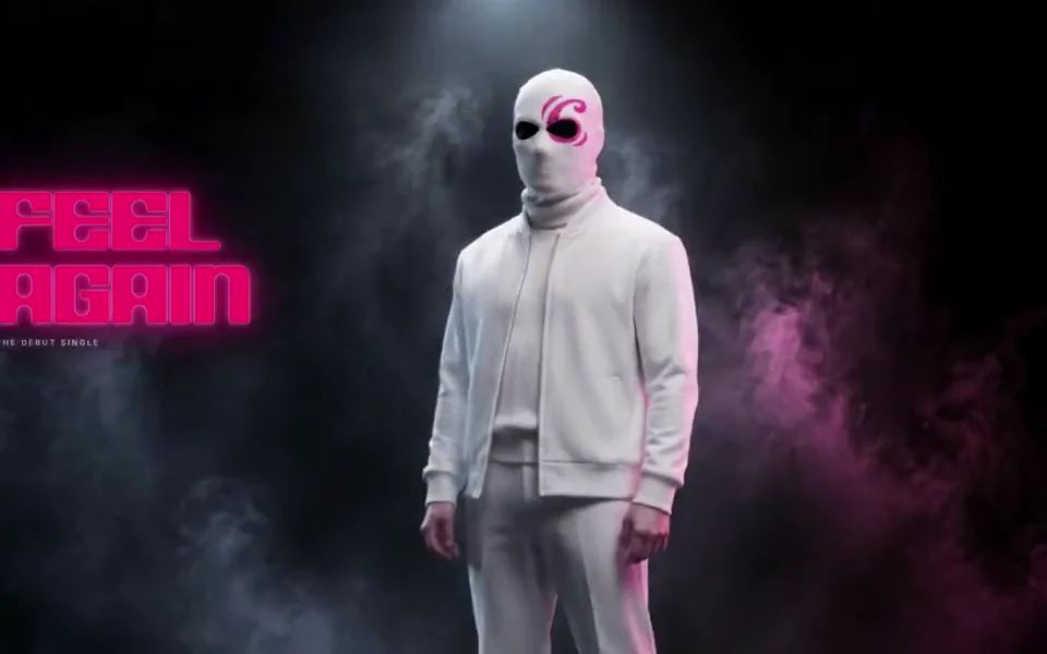 A music artist's release site: a masked figure in white under a spotlight